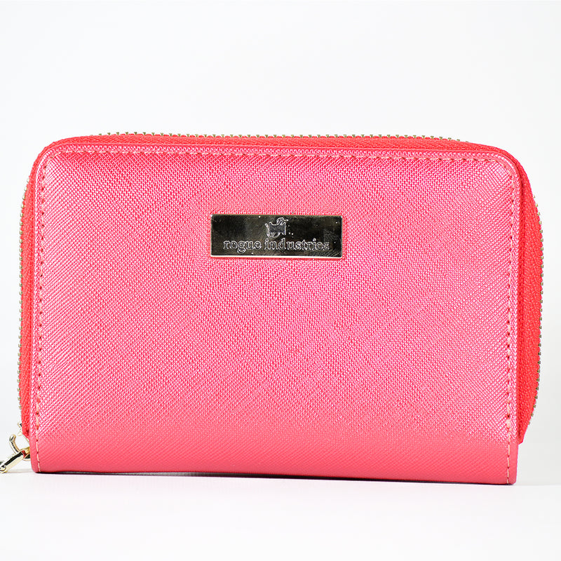 A pink rectangular zippered wallet with a metallic logo plate that reads "Rogue Industries" on the front, featuring a stylish saffiano finish.