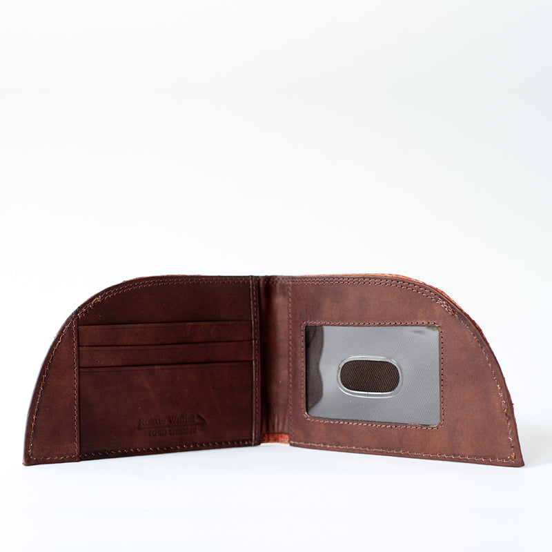 Displayed against a plain white background, the Factory Second Made in Maine Front Pocket Wallet - SALMON from Rogue Industries features card slots, a transparent ID window, and is crafted with RFID-blocking technology.